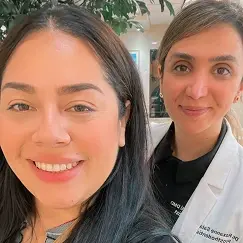 Smiling dentist and patient taking a selfie together at Beverly Hills dental practice.